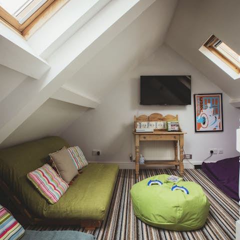 Hide away in the attic room with a games consol and bean bags