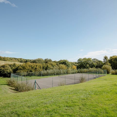 Up the ante with a round of tennis on the shared courts