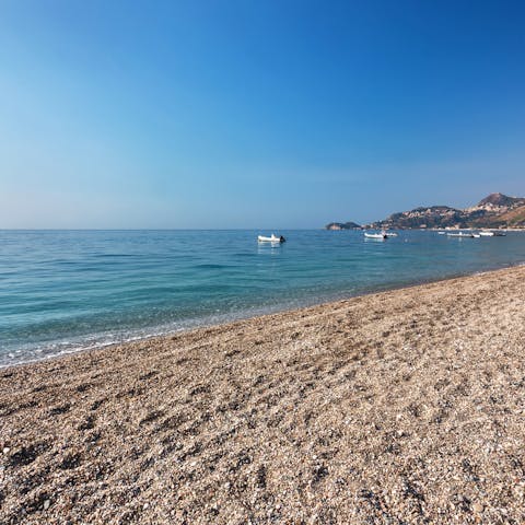 Head over to the stretch of beach opposite the home and cool off in the Ionian Sea