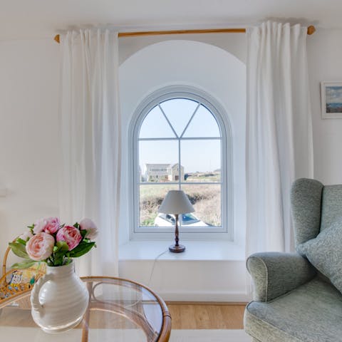 Gaze out of the chapel-style arched window over the beautiful countryside