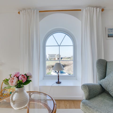 Gaze out of the chapel-style arched window over the beautiful countryside