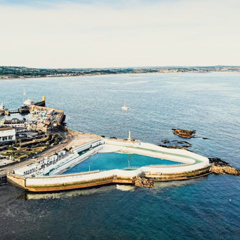 Enjoy a dip in the stunning geothermal Jubilee Pool in Penzance, 10 miles away