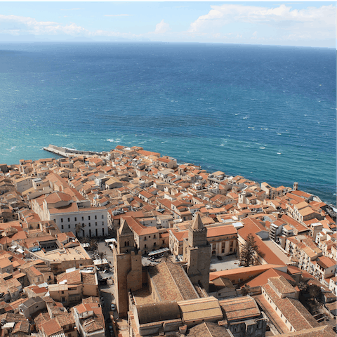 Explore the beautiful town of Cefalù and its medieval, cobblestone streets, beaches, and restaurants