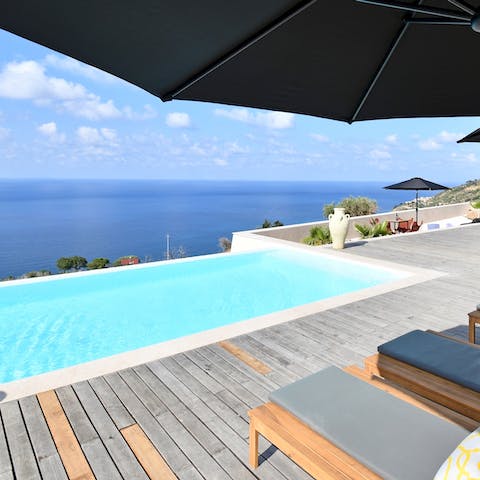 Spend blissful days lounging by the infinity pool, taking a dip and swimming to the edge to take in the full scene