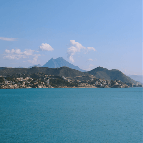 Spend the day on a boat trip, catching views of the majestic Awana Mountains