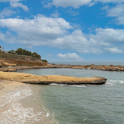 Enjoy a sun-soaked day on Platja de l' Amerador, a short walk away