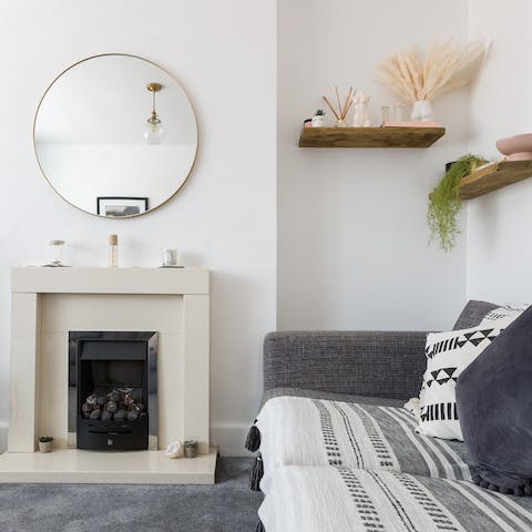 Snuggle up around the fireplace in the cosy living room