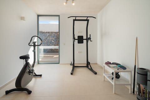 Keep up with your fitness routine in the villa's gym