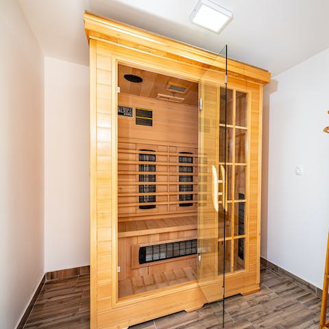 Relax and unwind in the wooden sauna 