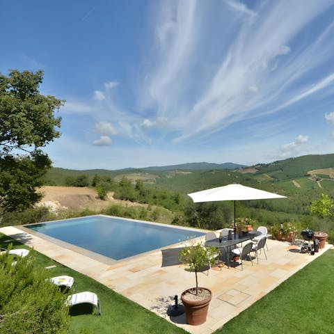Sunbathe poolside while admiring postcard views of the rolling hills