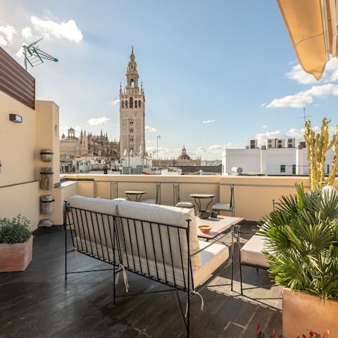 Relax with a glass of Spanish wine on the shared roof terrace