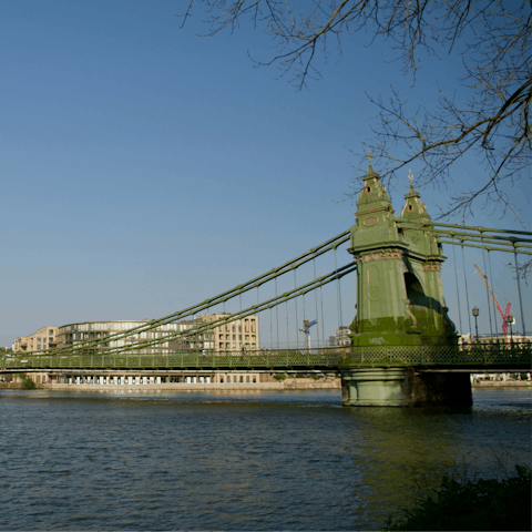 Grab a pint at the riverfront pubs and admire Hammersmith Bridge