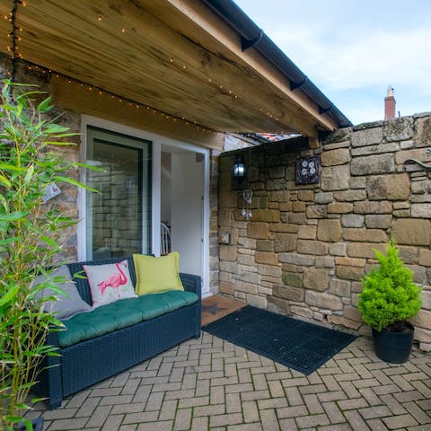 Lounge on the outdoor sofa with a coffee or a cocktail