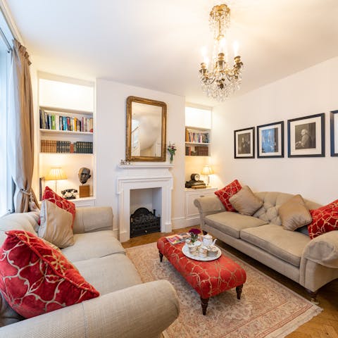 Make yourself at home in the elegant living room with a cup of tea and one of the books from the shelves