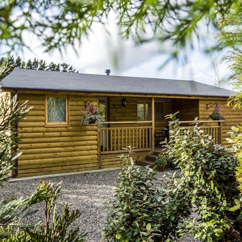 Stay in a beautiful log cabin surrounded by garden landscapes