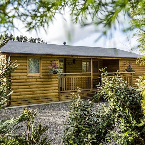 Stay in a beautiful log cabin surrounded by garden landscapes