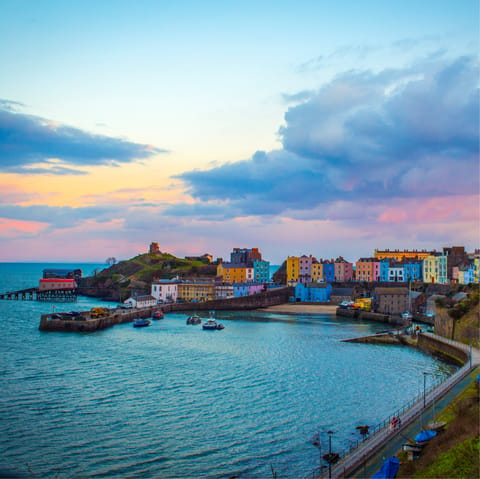 Visit Tenby and its award-winning beaches, eight minutes away by car