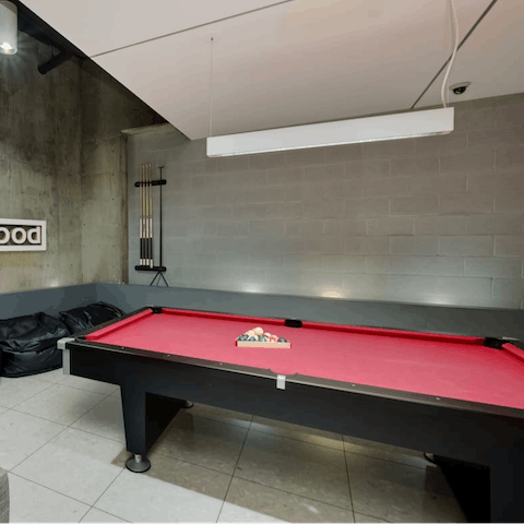 Play a game of pool in the shared lounge