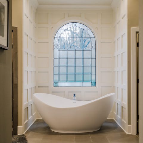 Relax and unwind in the decadent bathtub