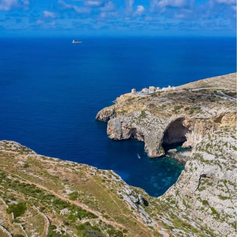 Take the five-minute drive to the Blue Grotto, with scenic sea caves accessible by boat