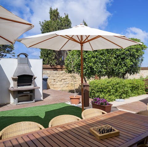 Indulge in a Mediterranean barbecue under the umbrellas after hiking at Il- Munxar