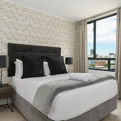 Wake up to city views in the comfortable bedrooms