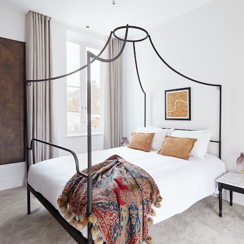 Wake up in this gloriously modern four-poster bed