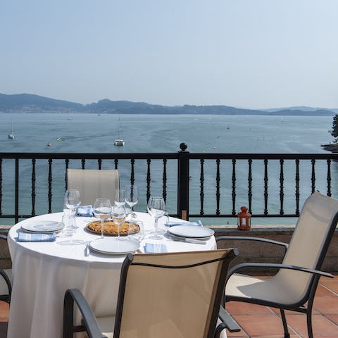 Open a bottle of wine and drink in the stunning seaside views on the terrace