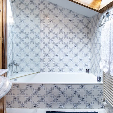 End the evening with a relaxing soak in the tiled bathtub