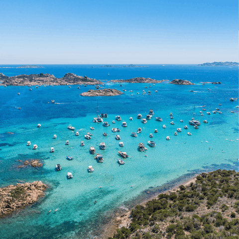Explore the rugged coastline of Sardinia and swim in the fresh blue water