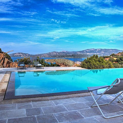 Laze around the pool whilst soaking in the stunning views of Sardinia