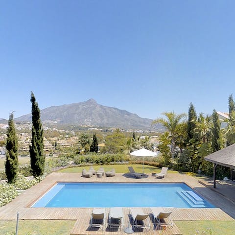 Gaze over views of the mountains from your stunning outdoor pool