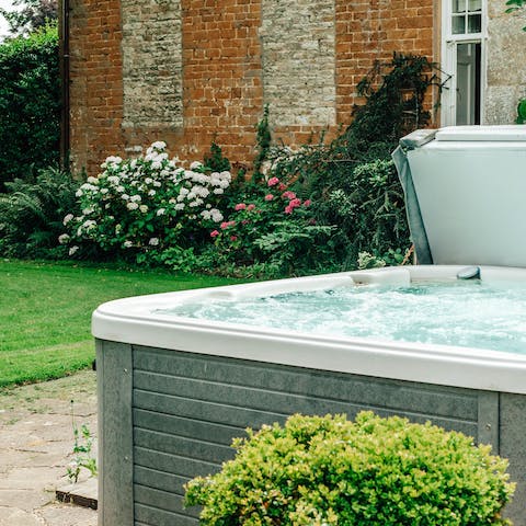Enjoy the garden views from the bubbling hot tub