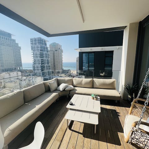 Take in the Tel Aviv cityscape from the private balcony