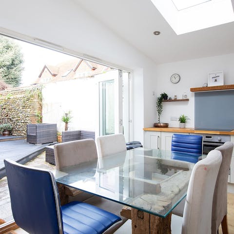 Tuck into a hearty breakfast as a gentle breeze drifts through the open bifold doors