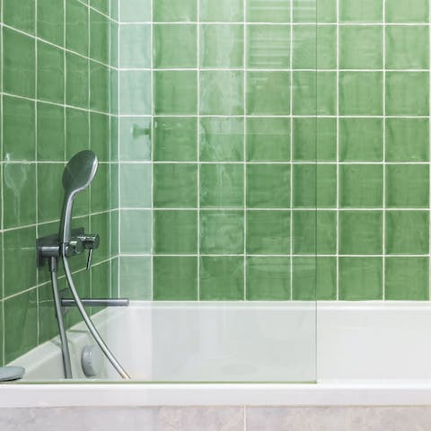 Treat yourself to a soak in the green tiled tub after a day of adventures on foot