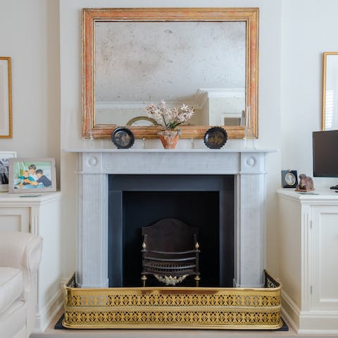 Marble fireplace feature in living area