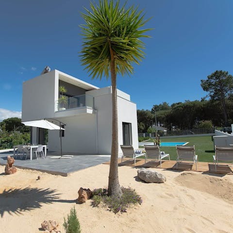 Sunbathe on the beachy area in the garden, before cooling down in the private pool