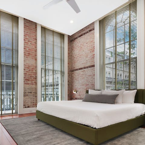 Wake up bathed in natural light from floor to ceiling windows