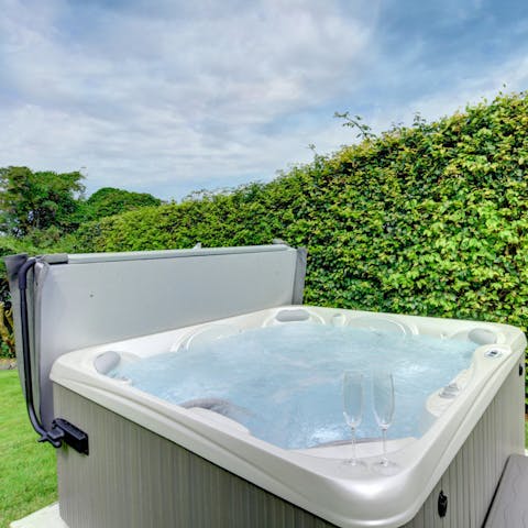 Indulge yourself in a private spa experience with your very own hot tub