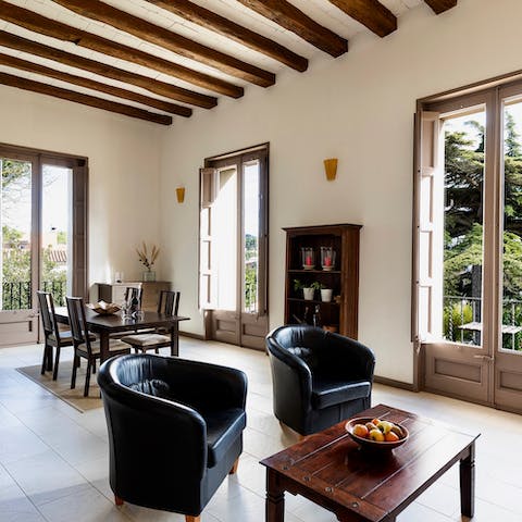 Admire the flat's old-world character, like the exposed wooden beams and huge windows