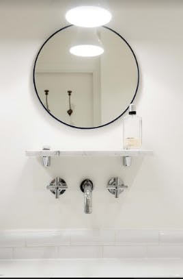 Slick contemporary fittings in the bathrooms