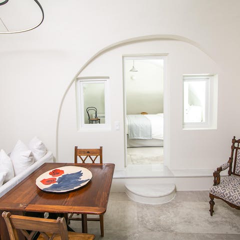 Retreat to a white-washed home, with typical features of Santorini design