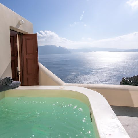 Sink into a private hot tub and let your cares melt away with caldera views