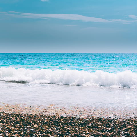 Sink your feet into the sea at Kerasia beach, a ten-minute drive away