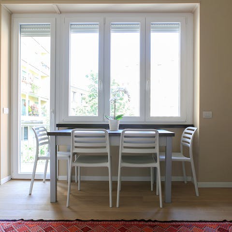 Eat your meals in front of the window in the bright dining area