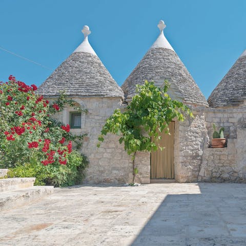 Stay in a traditional trulli house in the Itria Valley