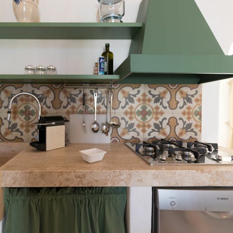 Whip up your favourite pasta dishes in the pretty tiled kitchen