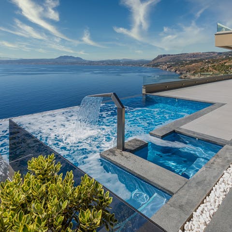 Relax in your infinity pool with panoramic views of the Aegean Sea