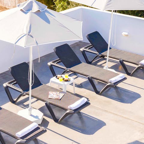 Kick back and relax on the sleek sun loungers